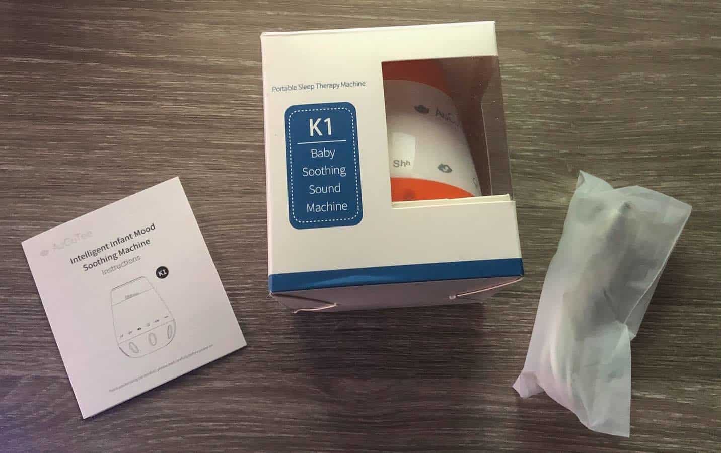 Verpackung, Ladekabel und Anleitung der K1 Baby